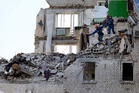 Zelensky vows retaliation after Russian strikes on Kyiv kill dozens
