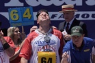 Joey Chestnut wins Nathan’s hot dog eating contest by stomaching 66 franks in 100-degree heat