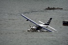 Eight people rescued after seaplane comes down in East River off New York City