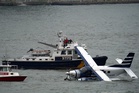 Eight people rescued after seaplane lands on New York City East River
