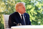 Trump piles pressure on Nato as he bigs up US military power