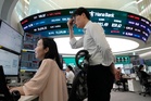 Asian markets retreat after rebounding AI stocks send the S&P 500 to brink of a new record