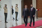 Explosions rock Damascus as French President Macron visits Syria