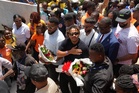 Members of Haiti's national soccer team tour their capital after playing in the World Cup