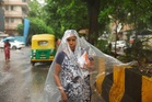 Three killed in Delhi building collapse as monsoon rains wreak havoc across India