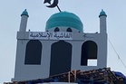 Police say mosque replica on top of loyalist bonfire is hate crime