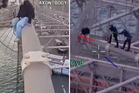 Heroic police officers scale Brooklyn Bridge to rescue woman