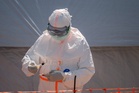 Dozens at an Ebola treatment center in northeast Congo go on strike over unpaid salaries and bonuses