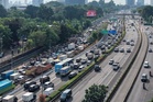 At least 13 killed after truck carrying wedding guests crushed on Indonesia highway