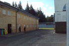 Male migrants detained at immigration centre caught looking through women’s bedrooms windows, report finds