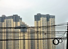 Man who parachuted off residential building in China arrested over stunt