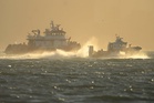 Search and rescue operation for a sunken pontoon boat near Alcatraz Island, in photos