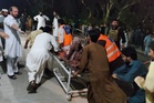 Twin attacks by militants kill 3 police officers, wound 20 in restive northwest Pakistan