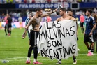 Argentina players celebrate beating England with ‘Falklands are Argentinian’ banner