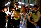 Argentina fan swarmed by England supporters in central London rescued by police