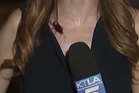 Reporter keeps calm as cockroach crawls over her during live broadcast