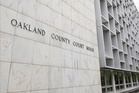 Michigan woman pleads no contest to abuse after 3 kids are found living alone for years