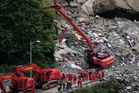 Rescuers in China race to find survivors after landslide kills at least 8