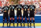 Match official goes viral after being caught on tiptoes in World Cup final group photo