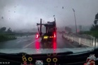 Terrifying moment car hurled into the air by tornado crossing highway