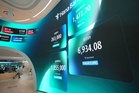 Shares skid in Asia in sell-off of AI-related shares as Brent oil tops $100 per barrel