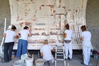 Pompeii archaeologists reconstruct frescoed ceiling of a banquet hall, with more fragments to come