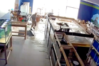 Giant fish tank breaks flooding pet store with 2000 gallons of water
