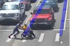 Spider-Man superhero shocks by helping man in wheelchair cross traffic