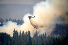 Oregon firefighters brace for windy and hot weather as they battle dozens of blazes