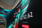 Oil prices sink 4% while Asian shares gain as Chinese chipmaker CXMT soars in Shanghai trading debut