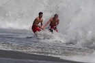 Dramatic rescue sees lifeguards battle terrifying waves to save boy off California