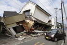 Death toll rises to 13 as rescuers search for the missing after Japan earthquake