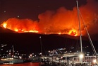 Wildfire rages on holiday island in Greece as people forced from their homes