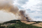 Holiday park evacuated as firefighters battle huge wildfire near nuclear power plant