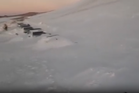 More than 200 tourists rescued from cars after massive snowstorm buries road in Argentina