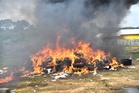 Authorities burn $336 million worth of cocaine as police officers are investigated