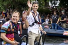Openly gay Dutch prime minister Rob Jetten sails in boat during Amsterdam Pride parade