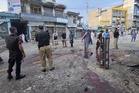 A suicide bomber strikes an anti-militant rally in northwestern Pakistan, killing at least 14