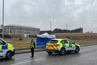 Man arrested after nine-year-old girl found injured at industrial estate dies