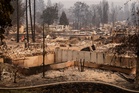 Man arrested for arson after wildfire destroys 700 buildings in Washington