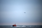 Boat carrying 157 migrants capsizes after catching fire in English Channel