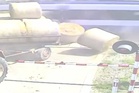 Moment train smashes through farm trailer after driver stops on tracks