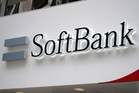 Japanese tech company SoftBank Group sees profit drop despite AI investments