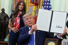 ‘Bobble head’ woman behind Trump during vaccine announcement becomes internet’s newest obsession