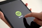 Spotify to label AI-generated artists and remove them from playlists