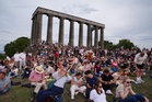 Scots contend with clouds to catch glimpse of rare solar eclipse