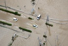 Record rain kills at least eight people in Japan and strands thousands at Tokyo airport