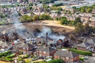 Man and woman arrested over grass fire that damaged four houses