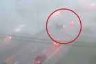 Watch as car is lifted up and blown across highway by fierce winds as powerful storm hits Ohio