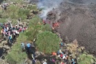 Hikers venture dangerously close to lava as Mount Etna erupts again